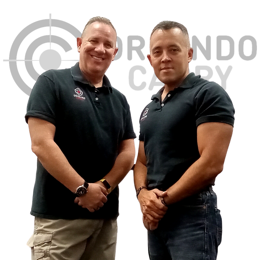 CCW Instructors Craig Schield and Luis Feliciano with Orlando Carry logo in background