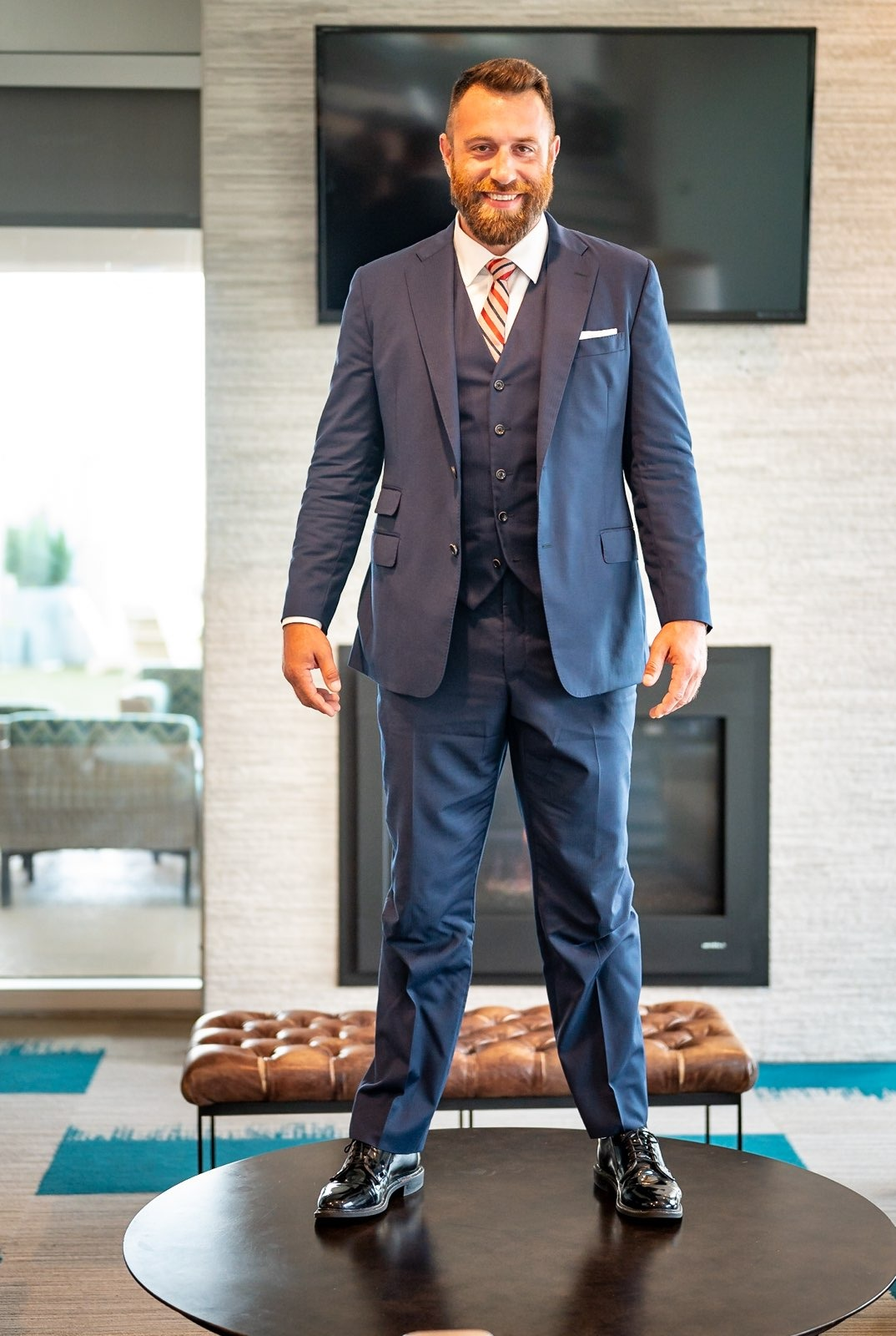Business Management Expert, wearing a grey suit from Team Addo. Michael J. Penny