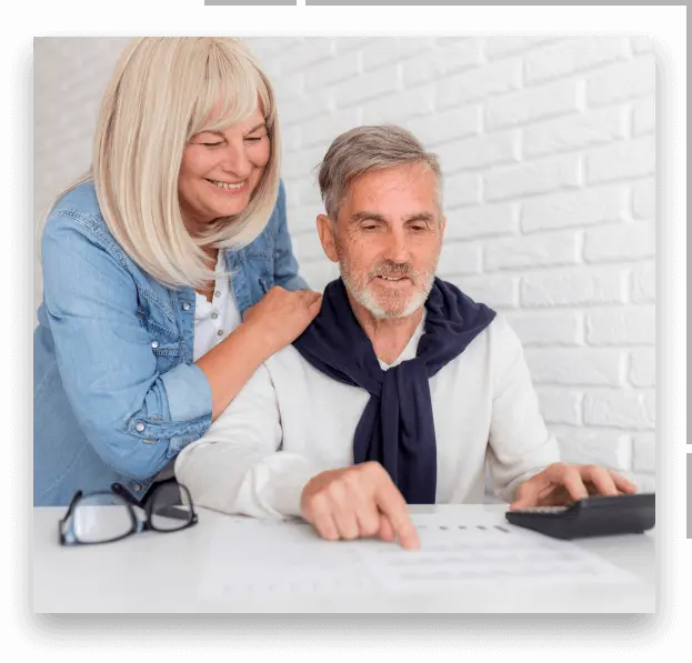 mature couple with paper and calculator