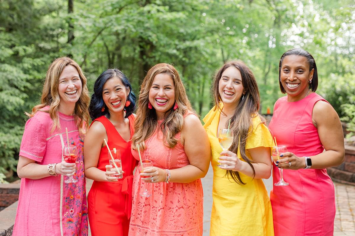 a group of women outside having drinks at Inspired Retreat