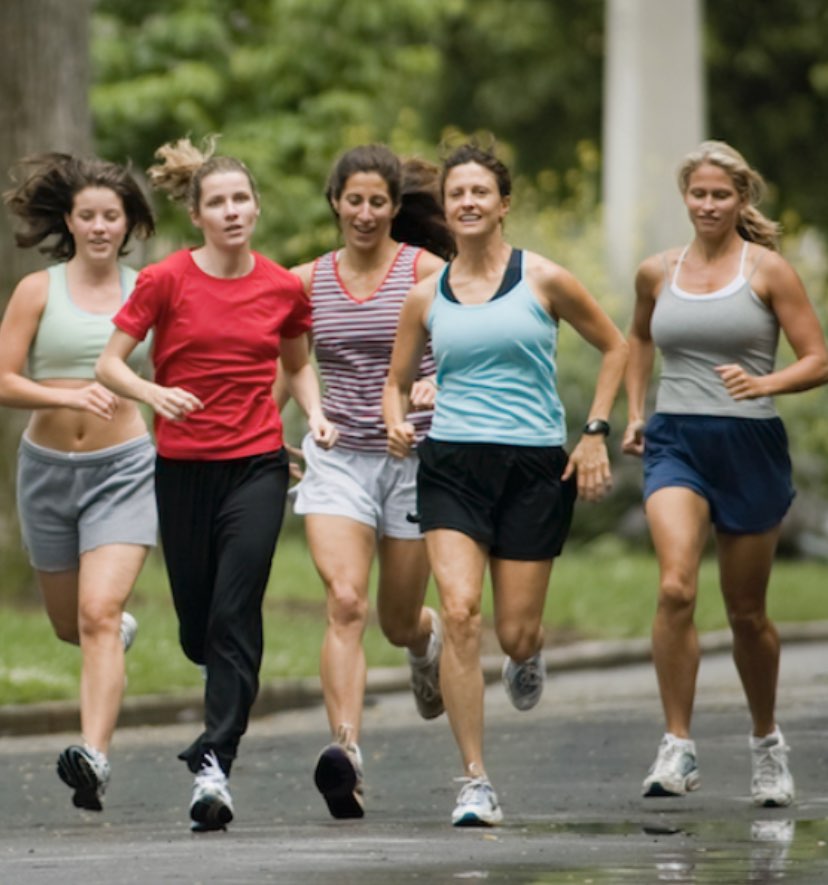 Group of women running down the road