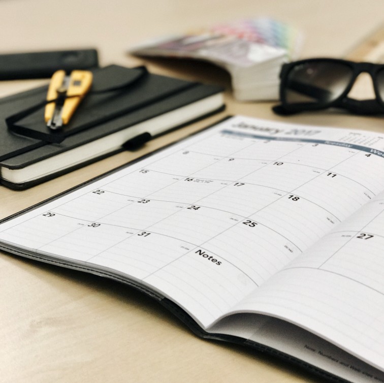 monthly planning calendar on desk