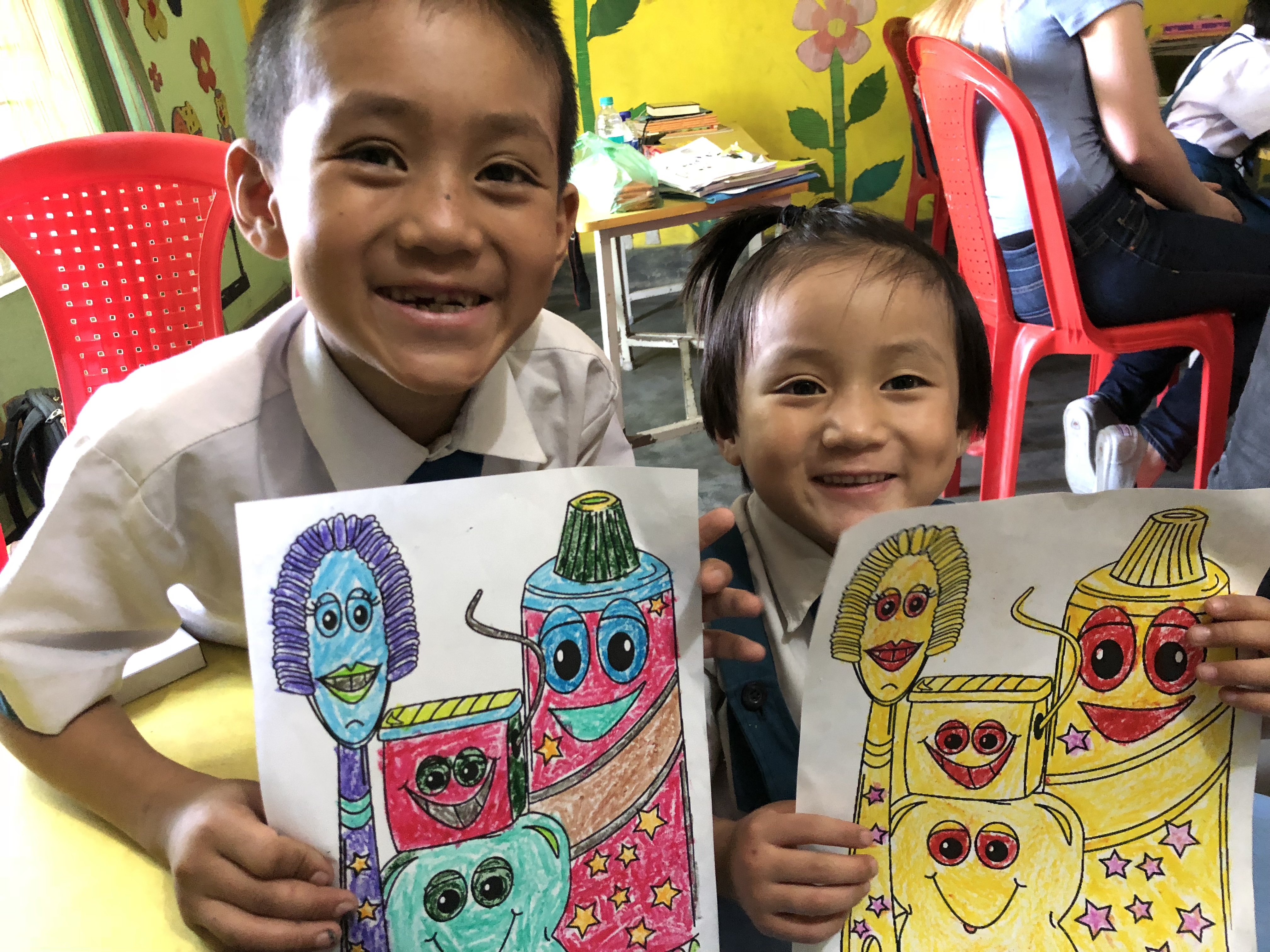 Students holding their art that they made