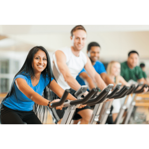 People cycling in spin class