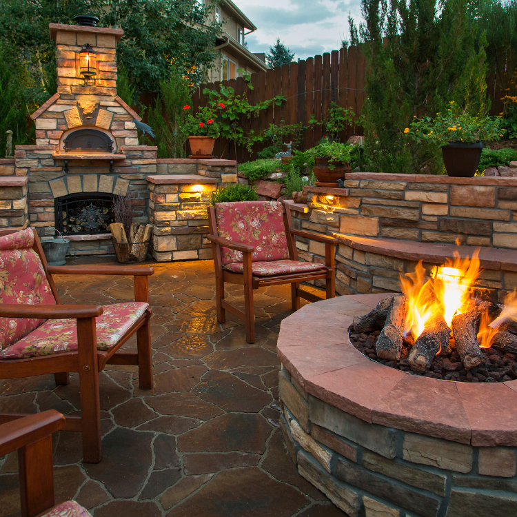Attractive brick paver patio with fire pit and grill