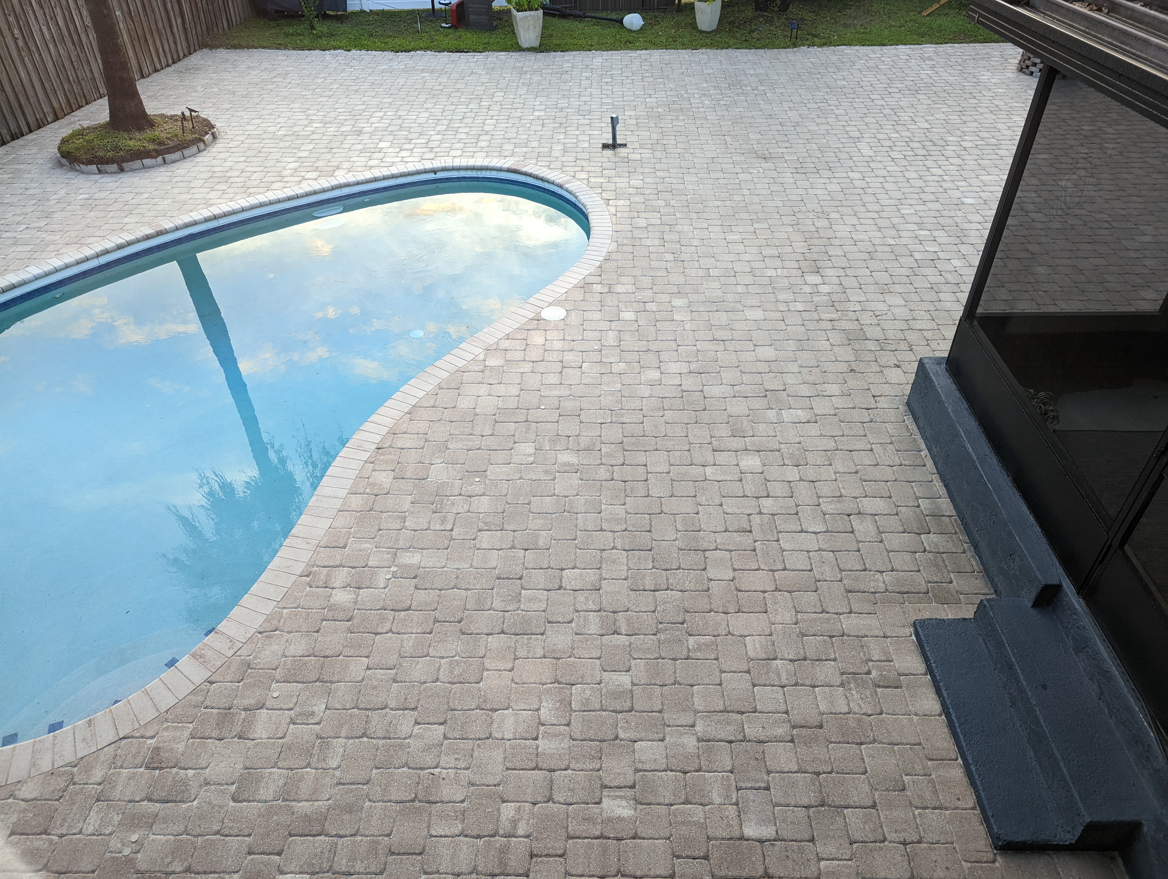 Paver pool deck with coping