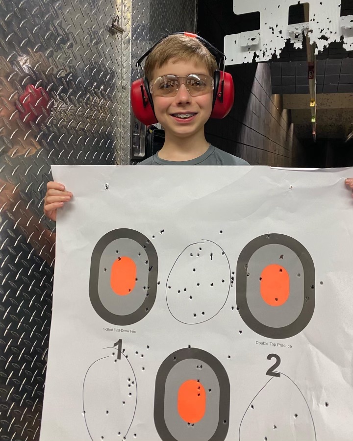 smiling boy student with shooting target