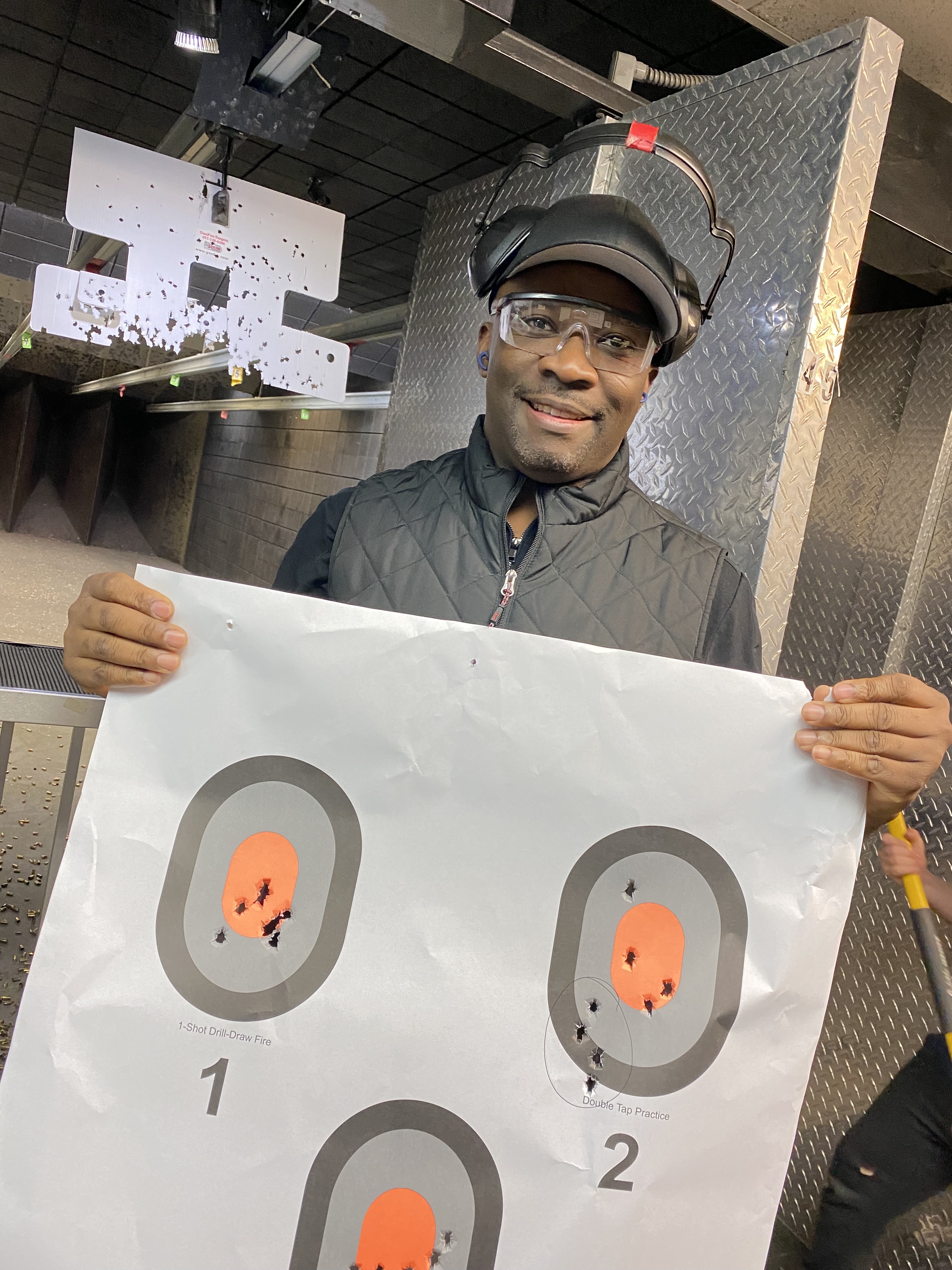 proud firearms student with target